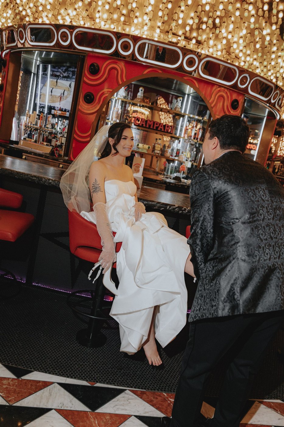 Editorial couple dancing under the Carousel Bar lights